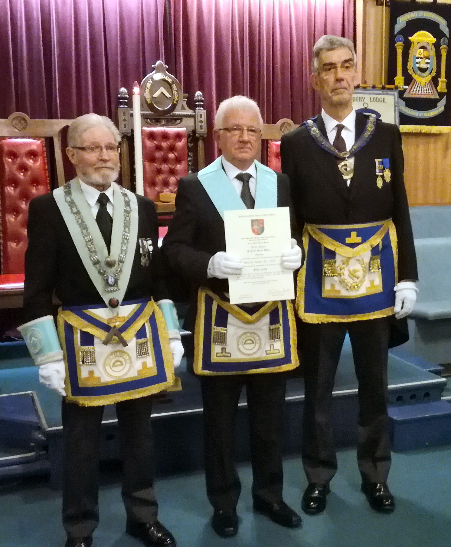 W. Bro Allan Jones receiving his 50-year Certificate from the rep of the RW Provincial Grand Master